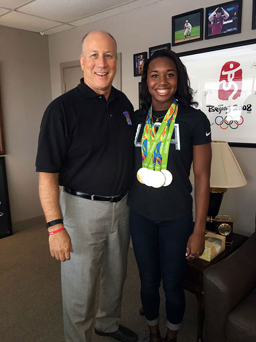 Robert B. Andrews with Simone Manuel
