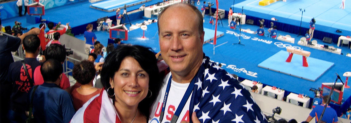 Robert and his wife at the Beijing Olympics gymnastics venue