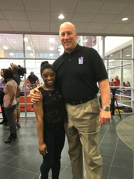 Robert B. Andrews with Simone Biles